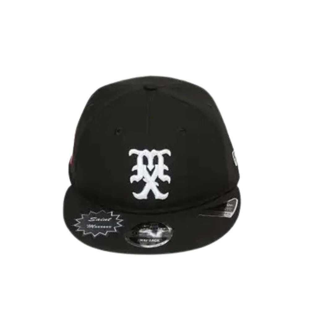 SAINT Mxxxxxx Celebrity Cap x New Era – Black SAINT Mxxxxxx Celebrity Cap x New Era – Black with white logo and classic streetwear design.